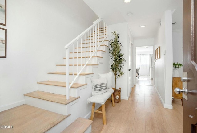 staircase featuring hardwood / wood-style flooring