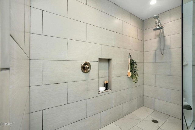 bathroom with tiled shower