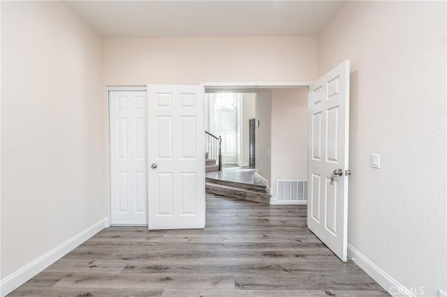 unfurnished bedroom featuring light wood-type flooring