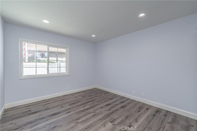 empty room with light hardwood / wood-style floors