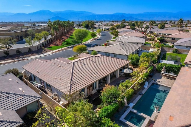 birds eye view of property with a mountain view