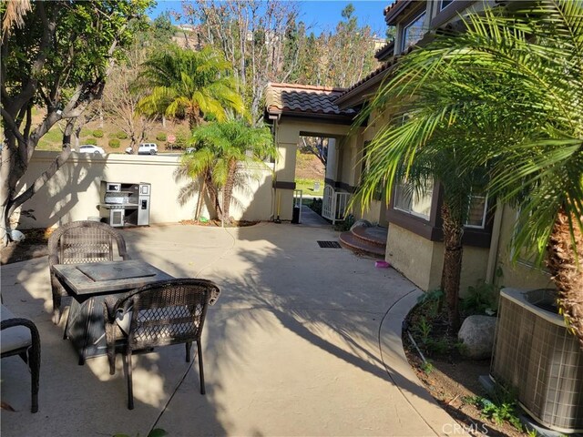 view of patio / terrace with central AC unit