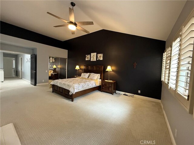 carpeted bedroom featuring ceiling fan and lofted ceiling