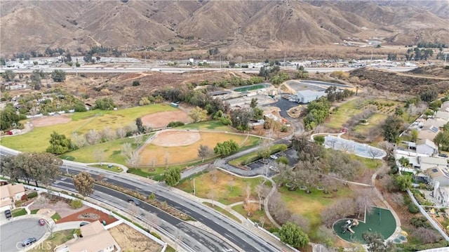 birds eye view of property featuring a mountain view