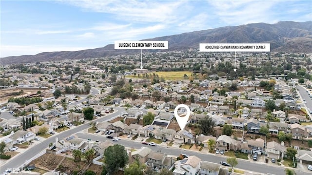 bird's eye view with a mountain view