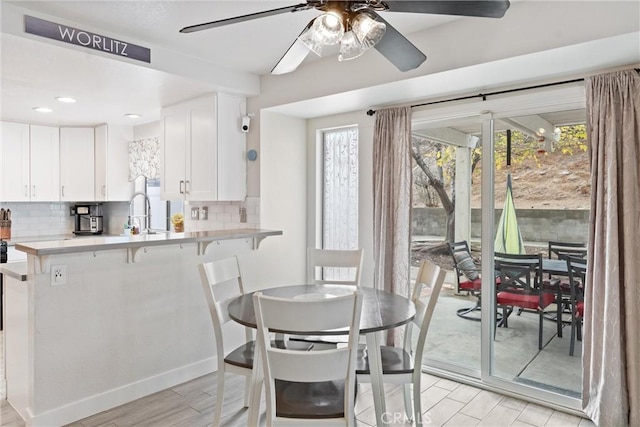 dining room with sink and ceiling fan