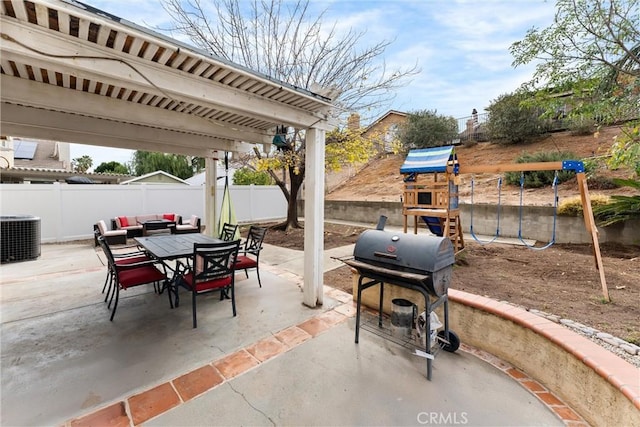 view of patio featuring central AC unit, area for grilling, and a playground