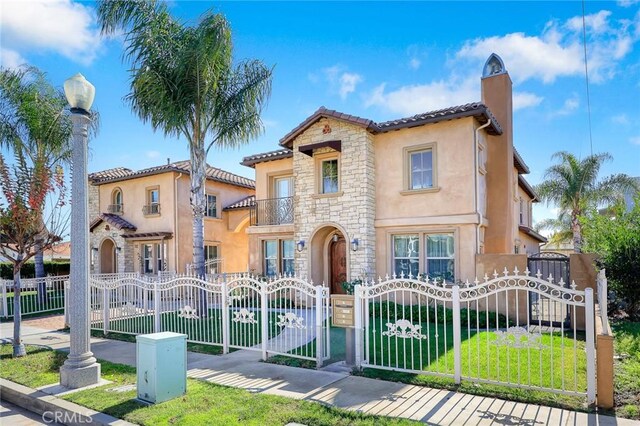 518 W Bencamp St, San Gabriel, CA 91776 - mediterranean / spanish house with a gate, stucco siding, and stone siding