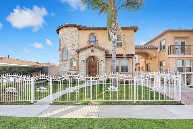 518 W Bencamp St, San Gabriel, CA 91776 - mediterranean / spanish-style house featuring stone siding, a gate, stucco siding, and a tile roof