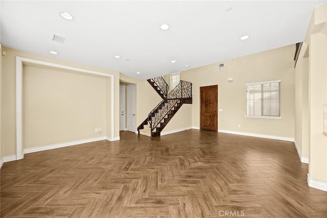 spare room with dark parquet flooring