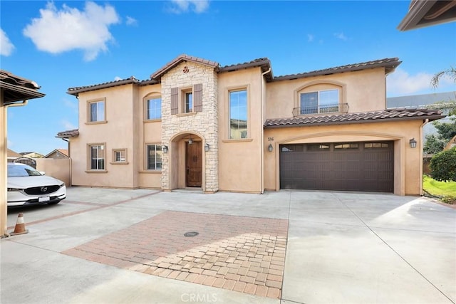 mediterranean / spanish-style house featuring a garage