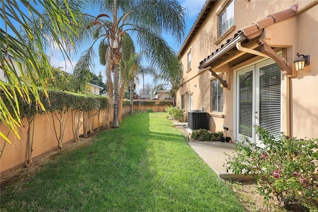 view of yard with central AC