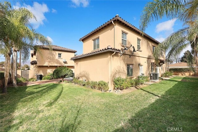 518 W Bencamp St, San Gabriel, CA 91776 - back of property featuring stucco siding, a yard, and a tiled roof