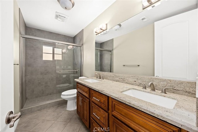 bathroom with vanity, an enclosed shower, tile patterned floors, and toilet