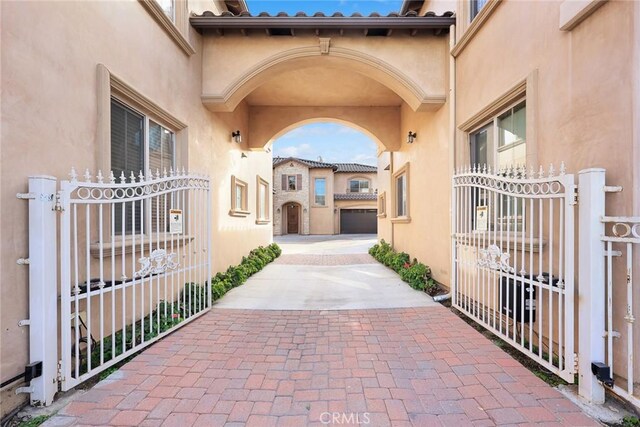 518 W Bencamp St, San Gabriel, CA 91776 - entrance to property featuring a gate and stucco siding