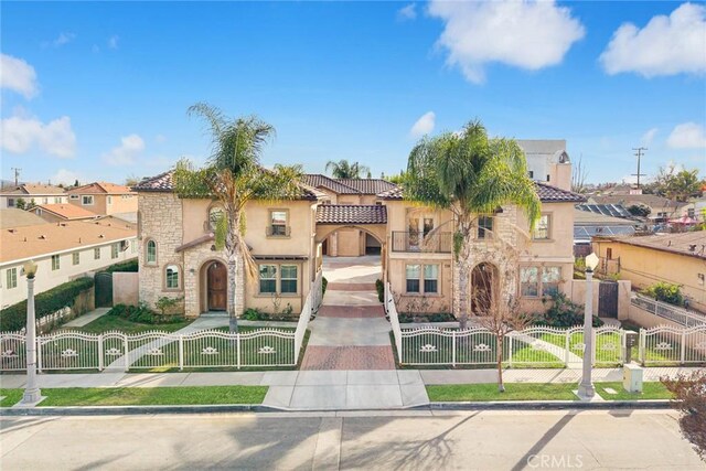 518 W Bencamp St, San Gabriel, CA 91776 - mediterranean / spanish-style home with stone siding, stucco siding, a tile roof, and a residential view