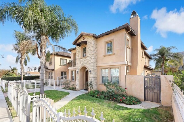 518 W Bencamp St, San Gabriel, CA 91776 - mediterranean / spanish home featuring a gate, a chimney, stone siding, and stucco siding