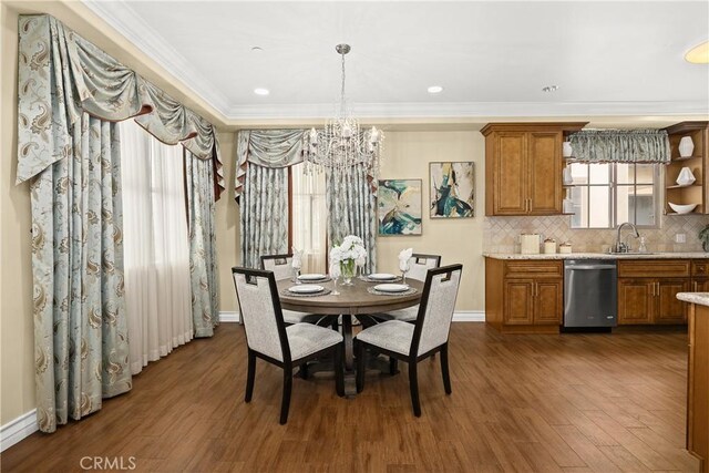 518 W Bencamp St, San Gabriel, CA 91776 - dining area with a chandelier, dark wood-style flooring, ornamental molding, and baseboards