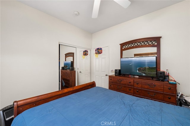 bedroom featuring ceiling fan and a closet