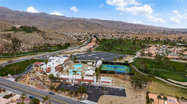 birds eye view of property with a mountain view