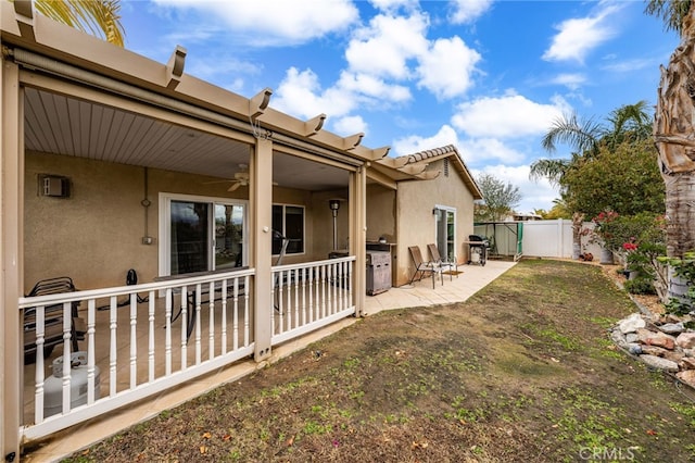 view of yard featuring a patio and ceiling fan