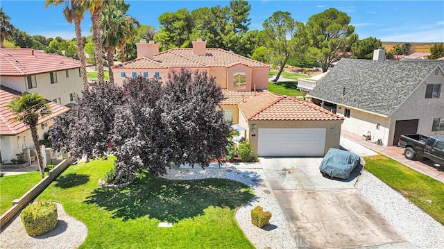 view of front of house with a garage and a front yard