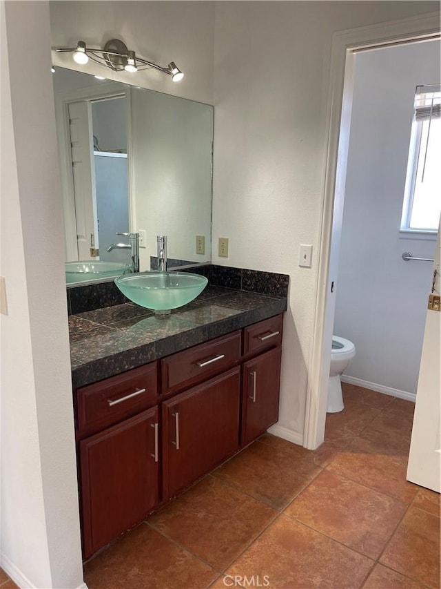 bathroom with vanity and toilet