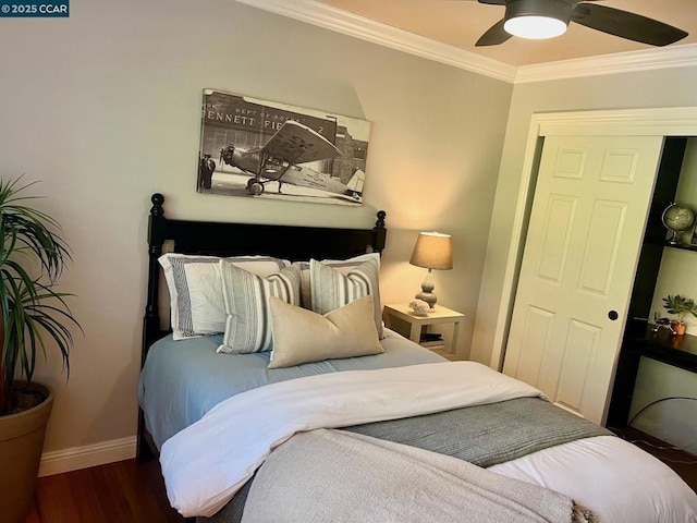 bedroom with ceiling fan, ornamental molding, and dark hardwood / wood-style floors