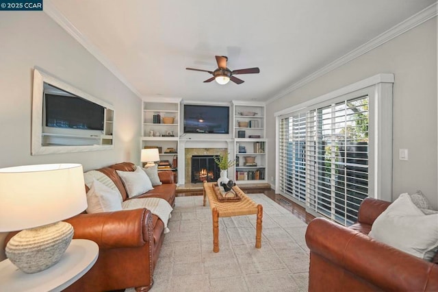 living room with ceiling fan, ornamental molding, and built in features