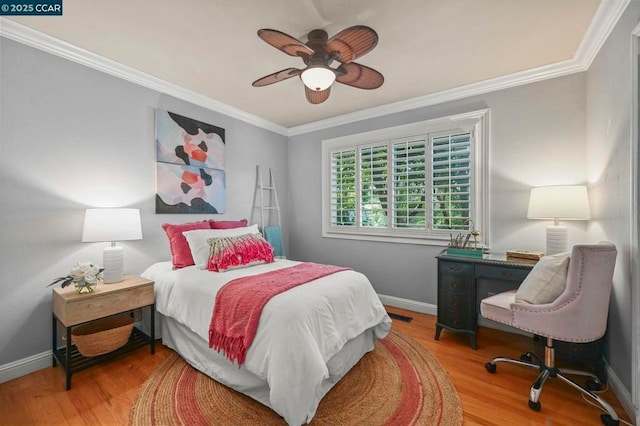 bedroom featuring ceiling fan, ornamental molding, and hardwood / wood-style floors