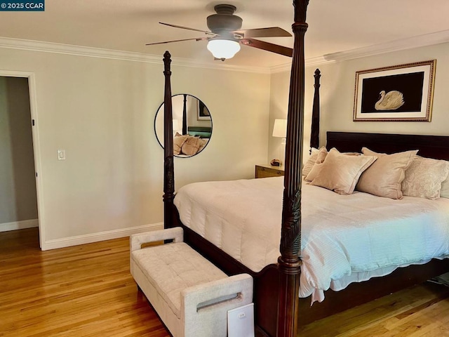 bedroom featuring ornamental molding, light hardwood / wood-style floors, and ceiling fan