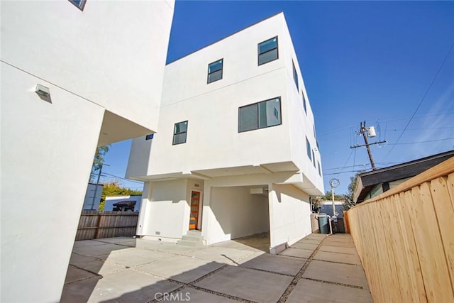 back of property with a patio area