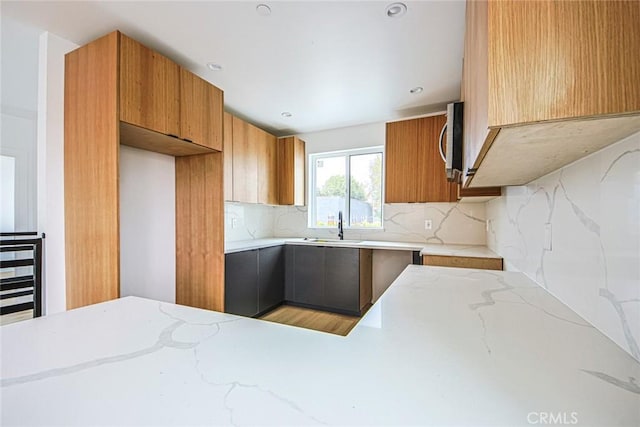 kitchen featuring sink and decorative backsplash