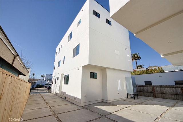 back of house with a patio area