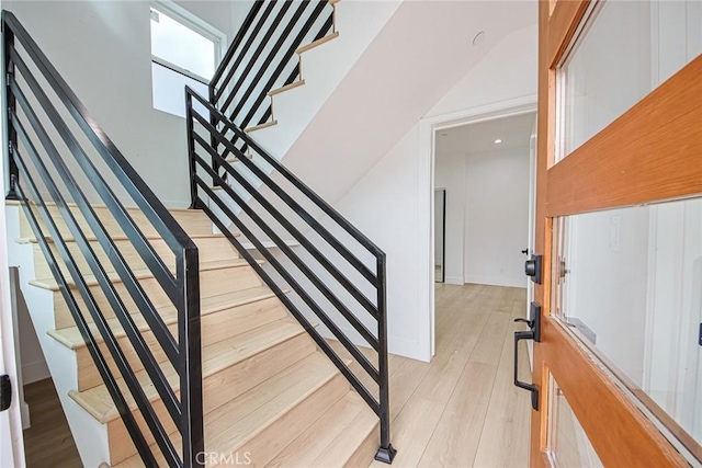 stairway featuring wood-type flooring