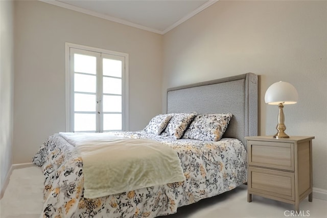 bedroom featuring ornamental molding and light carpet