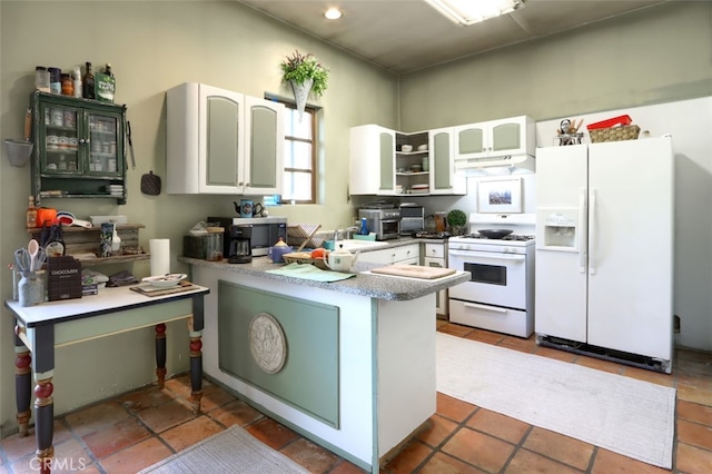 kitchen featuring white cabinetry, white appliances, kitchen peninsula, and tile patterned flooring