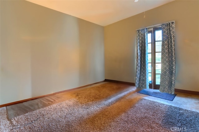 unfurnished room featuring carpet