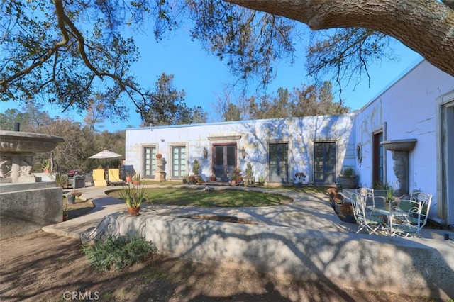 view of front of home with a patio area