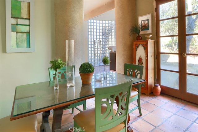 tiled dining room with french doors