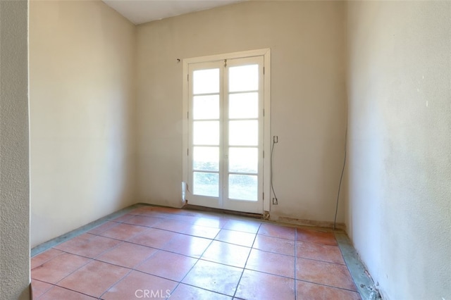 doorway featuring light tile patterned flooring