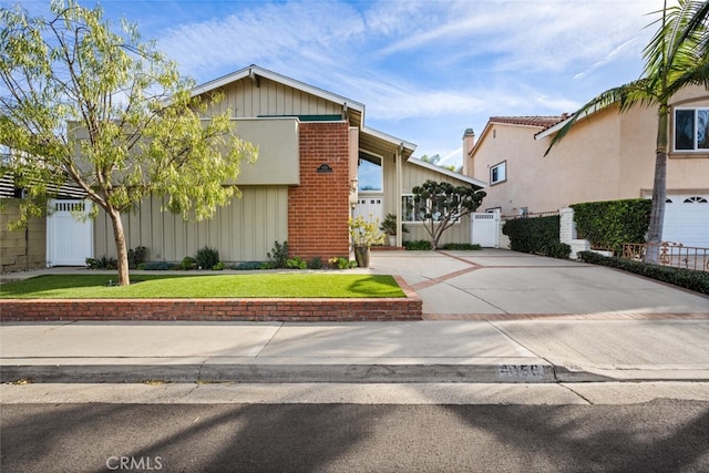 view of front of house with a garage and a front yard