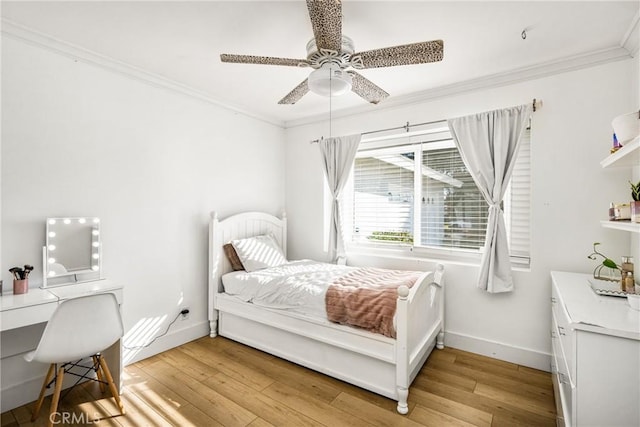 bedroom featuring crown molding, ceiling fan, and light hardwood / wood-style floors