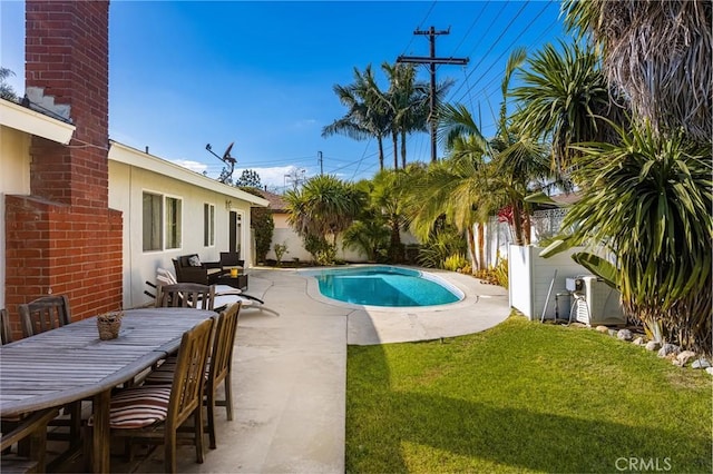 view of pool with a yard and a patio area