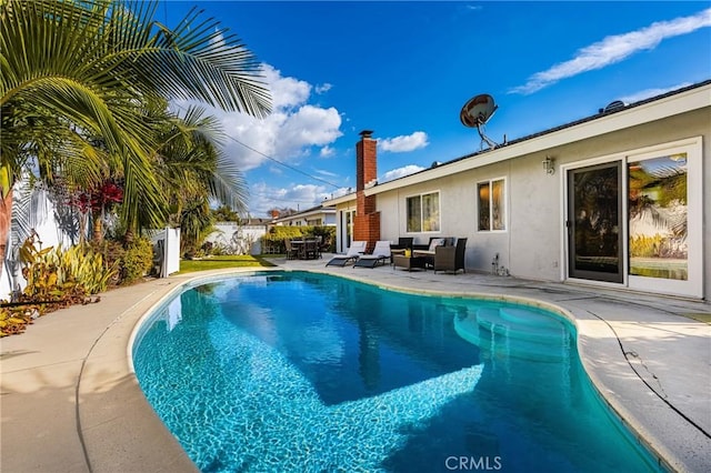 view of swimming pool featuring a patio