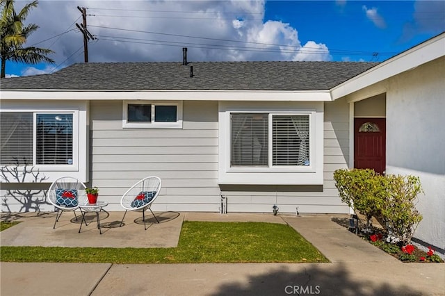 entrance to property with a patio area