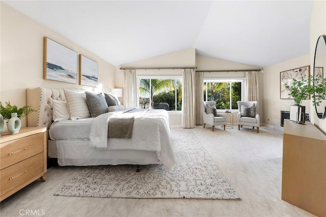 carpeted bedroom with vaulted ceiling