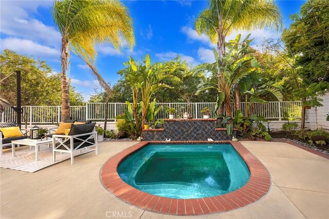 view of swimming pool with an outdoor living space and a patio