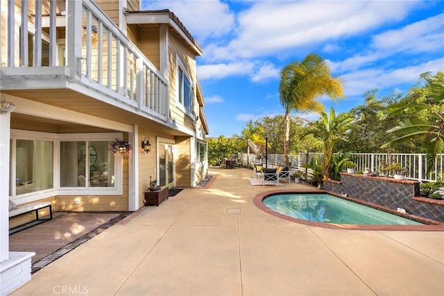 view of swimming pool featuring a patio