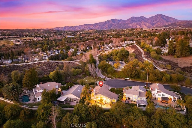 aerial view at dusk with a mountain view